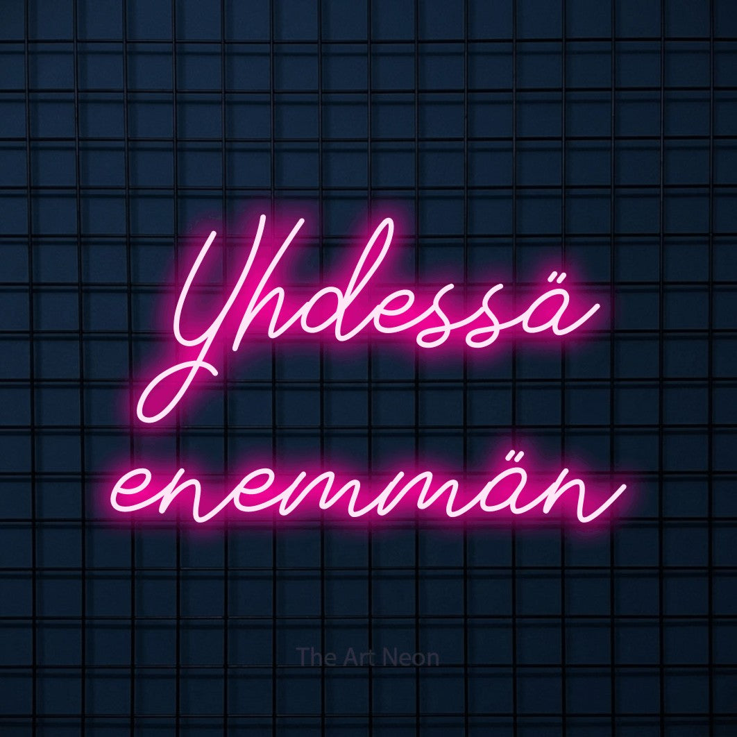 LED neon sign reading “Yhdessä enemmän”, arranged in 2 lines.