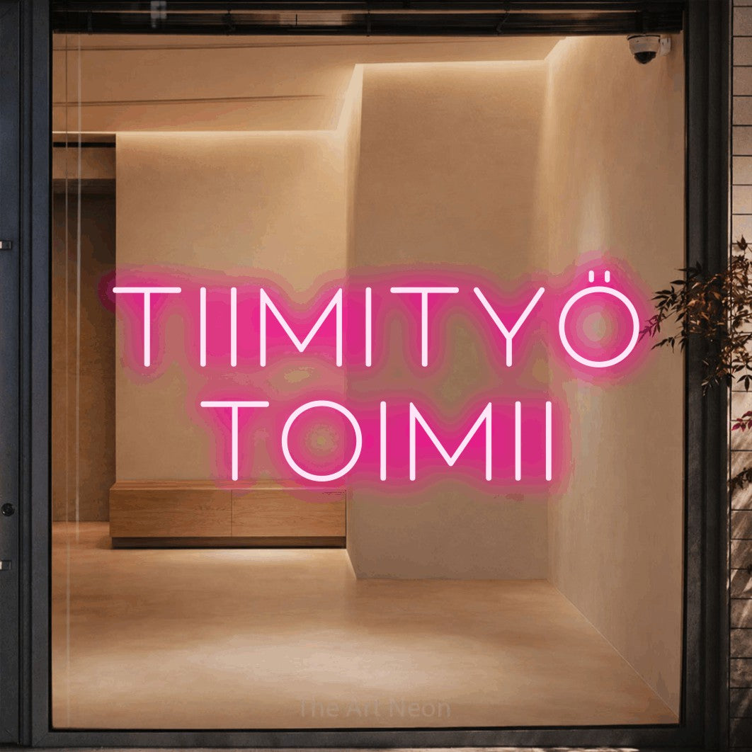 LED neon sign reading “Tiimityö toimii”, arranged in 2 lines.