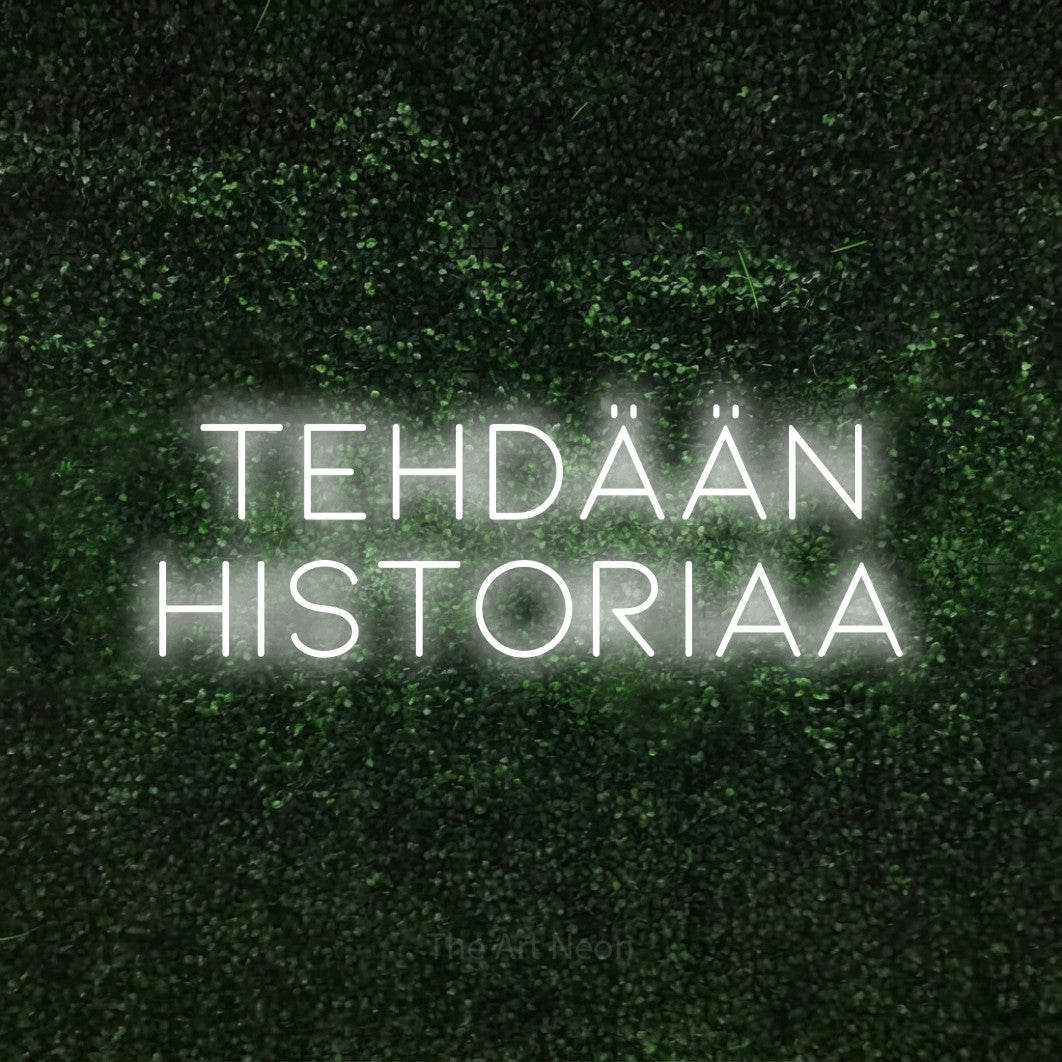 LED neon sign reading “TEHDÄÄN HISTORIAA”, arranged in 2 lines.