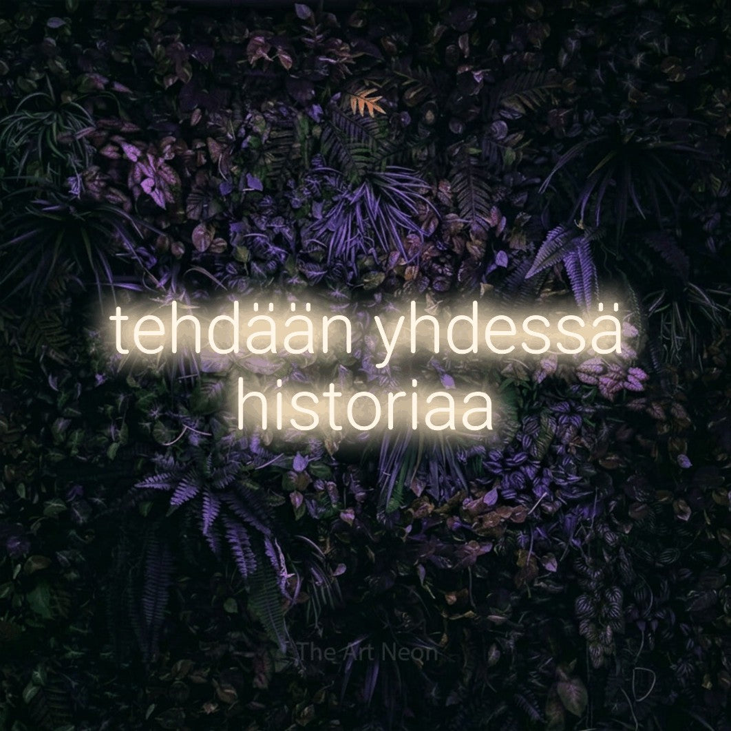 LED neon sign reading “tehdään yhdessä historiaa”, arranged in 2 lines.