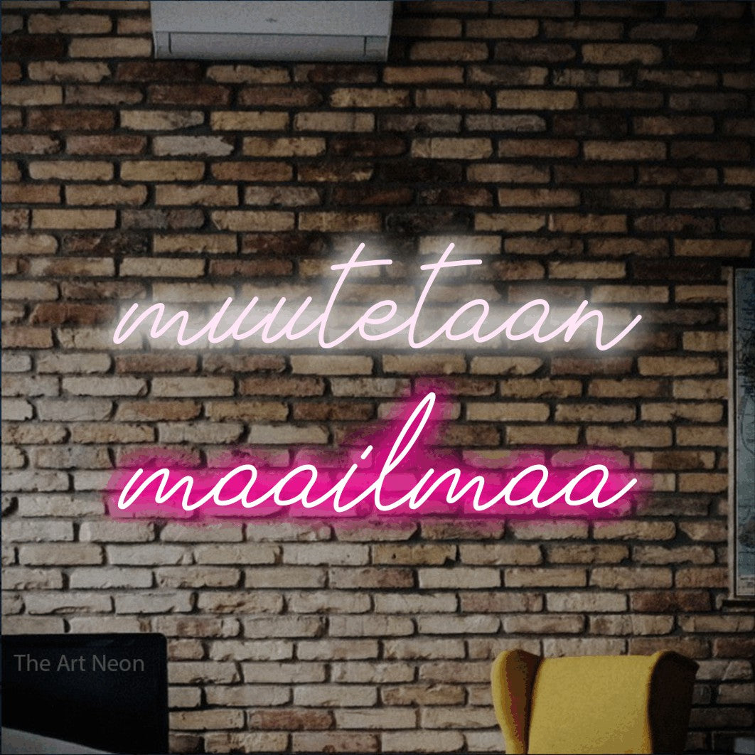 LED neon sign reading “muutetaan maailmaa”, arranged in 2 lines.