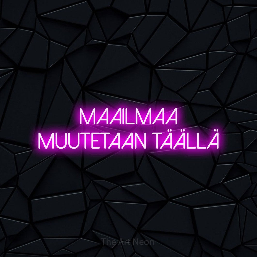 LED neon sign reading “Maailmaa muutetaan täällä”, arranged in 2 lines.