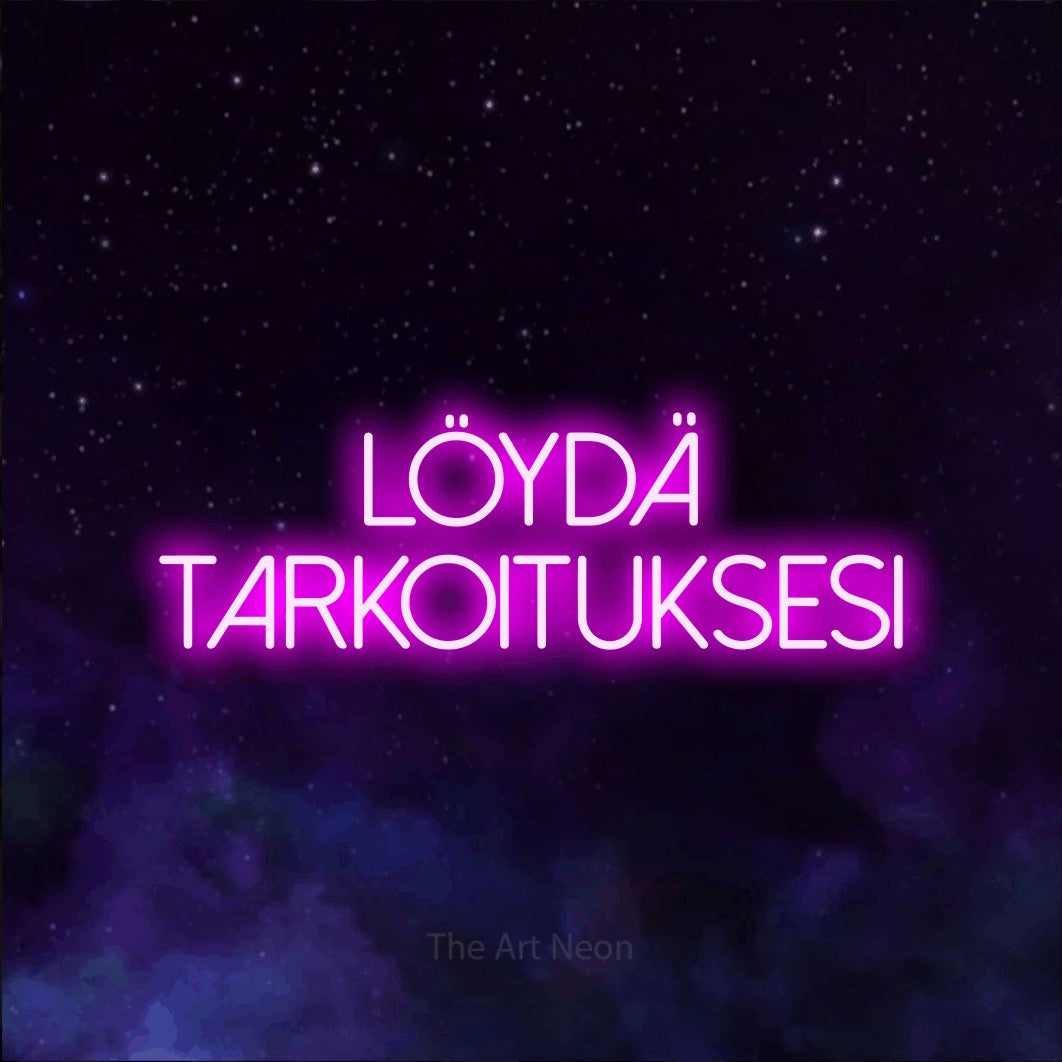 LED neon sign reading “löydä TARKOITUKSESI”, arranged in 2 lines.