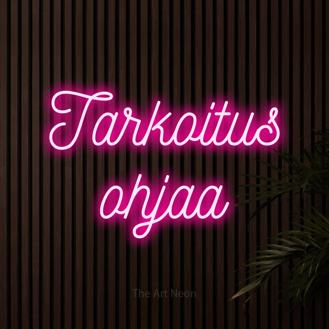 LED neon sign reading “Tarkoitus ohjaa”, arranged in 2 lines.