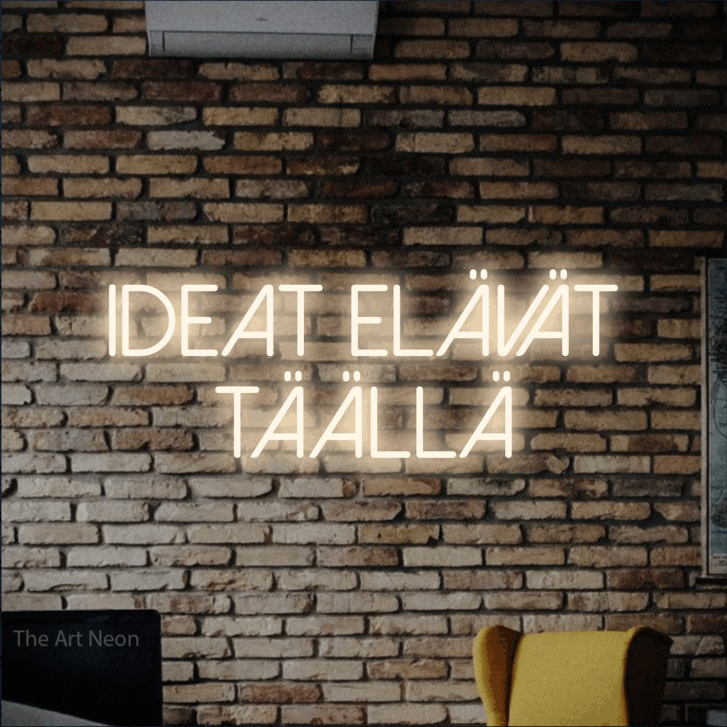 LED neon sign reading “ideat elävät täällä”, arranged in 2 lines.