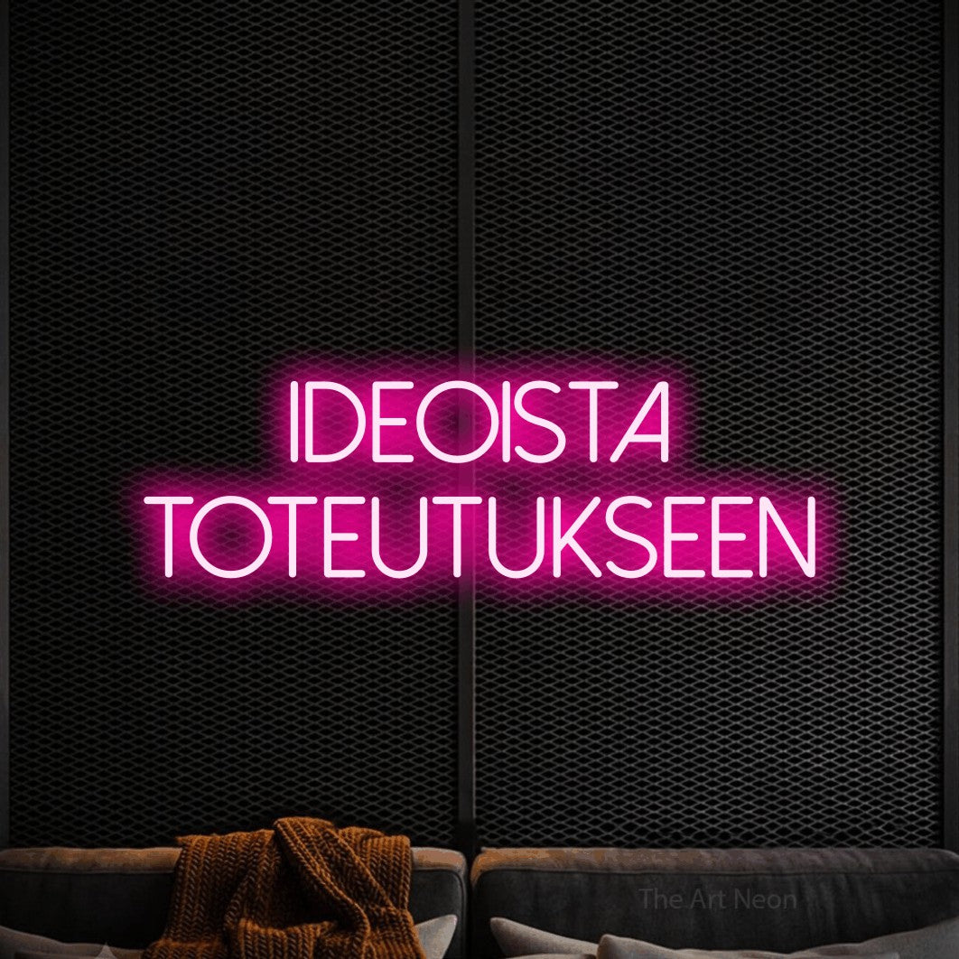 LED neon sign reading “ideoista toteutukseen”, arranged in 2 lines.