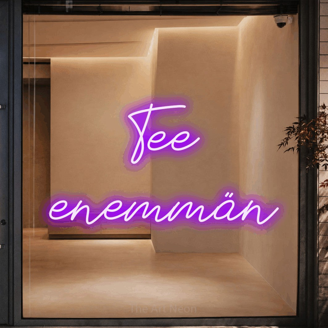 LED neon sign reading “Tee enemmän”, arranged in 2 lines.