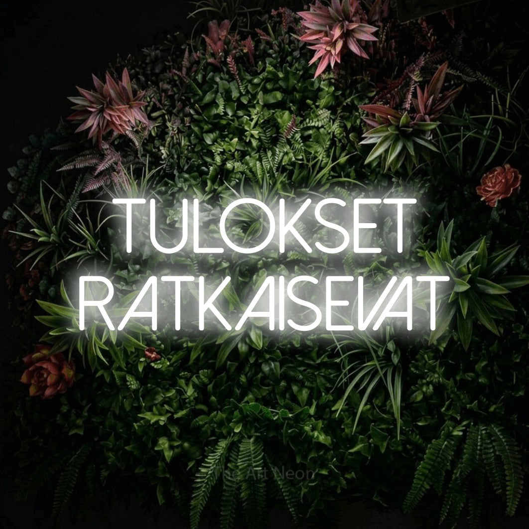LED neon sign reading “TULOKSET RATKAISEVAT”, arranged in 2 lines.