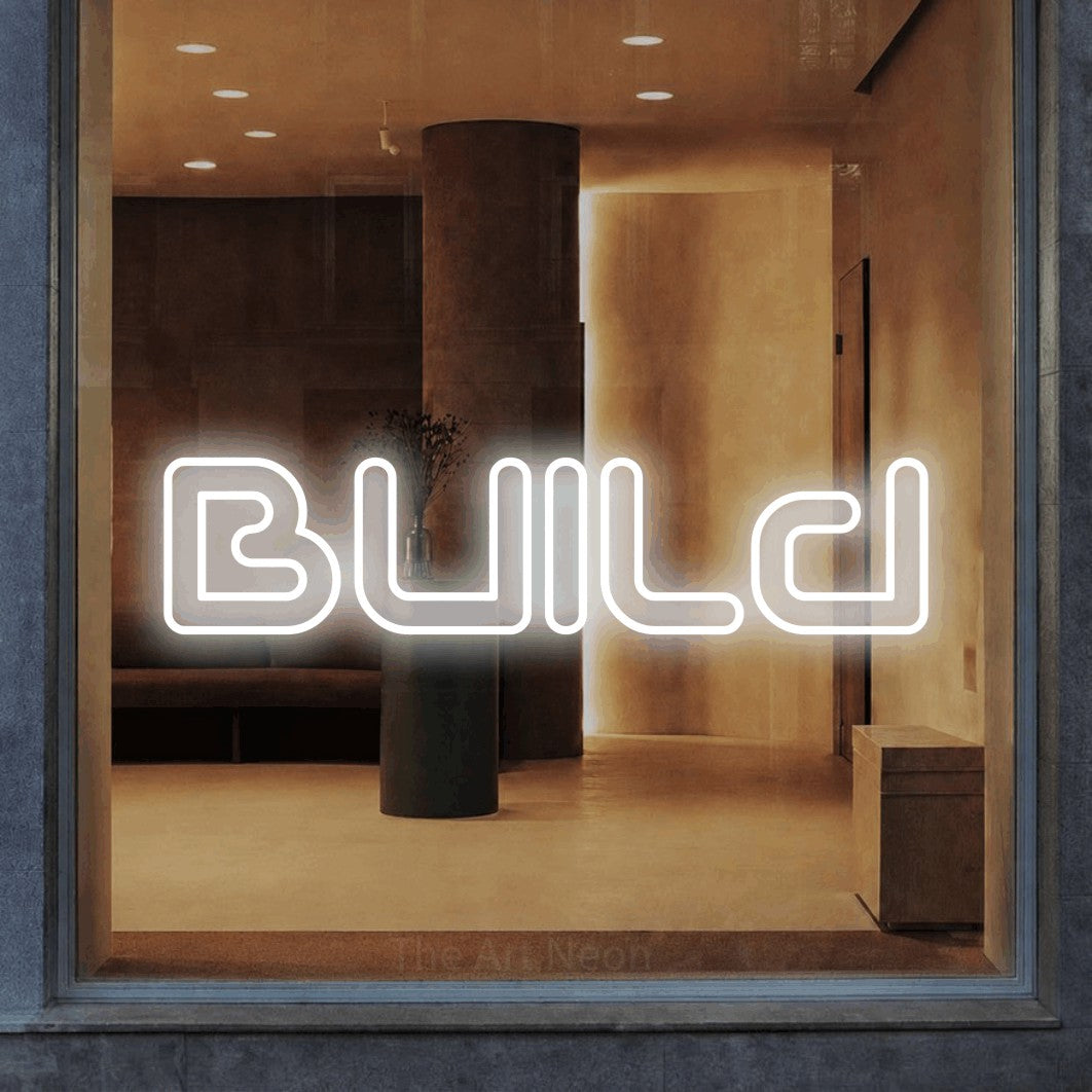 LED neon sign reading “Build”, arranged in a single line.