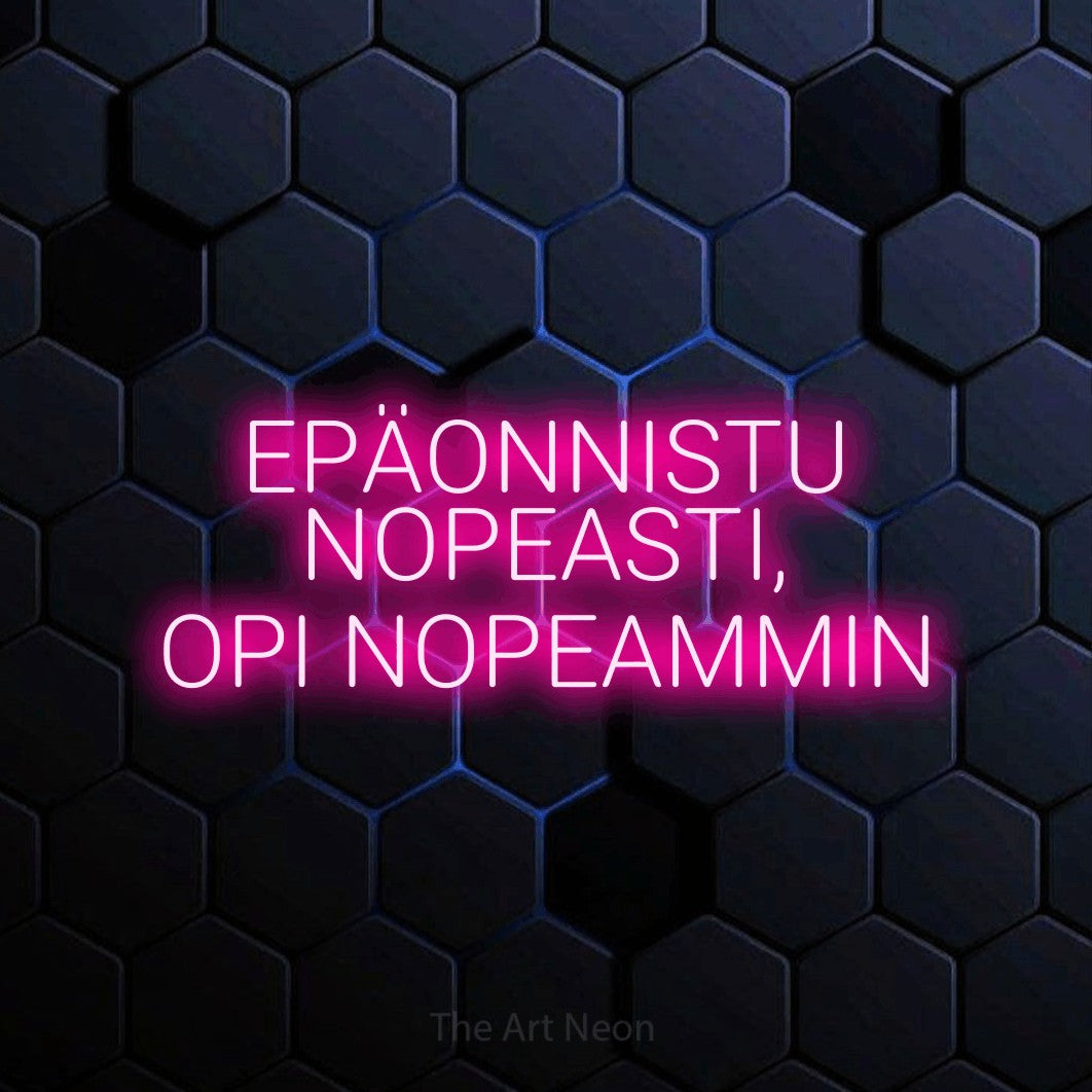 LED neon sign reading “EPÄONNISTU NOPEASTI, OPI NOPEAMMIN”, arranged in 3 lines.