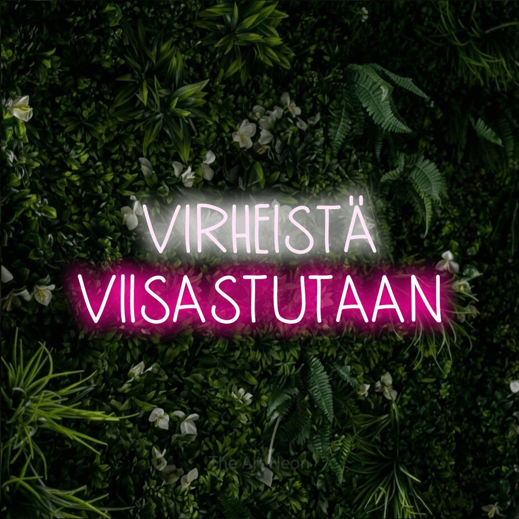 LED neon sign reading “VIRHEISTÄ VIISASTUTAAN”, arranged in 2 lines.