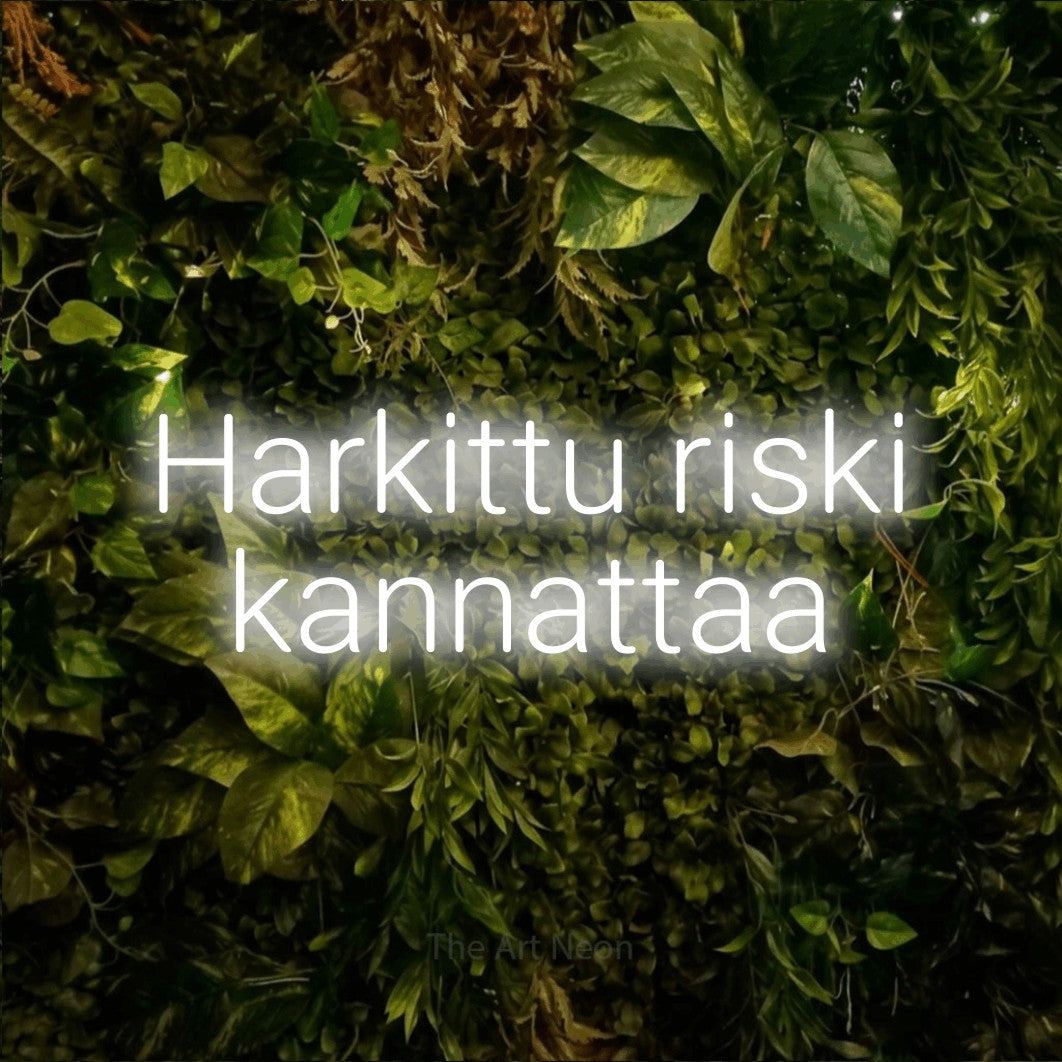 LED neon sign reading “Harkittu riski kannattaa”, arranged in 2 lines.
