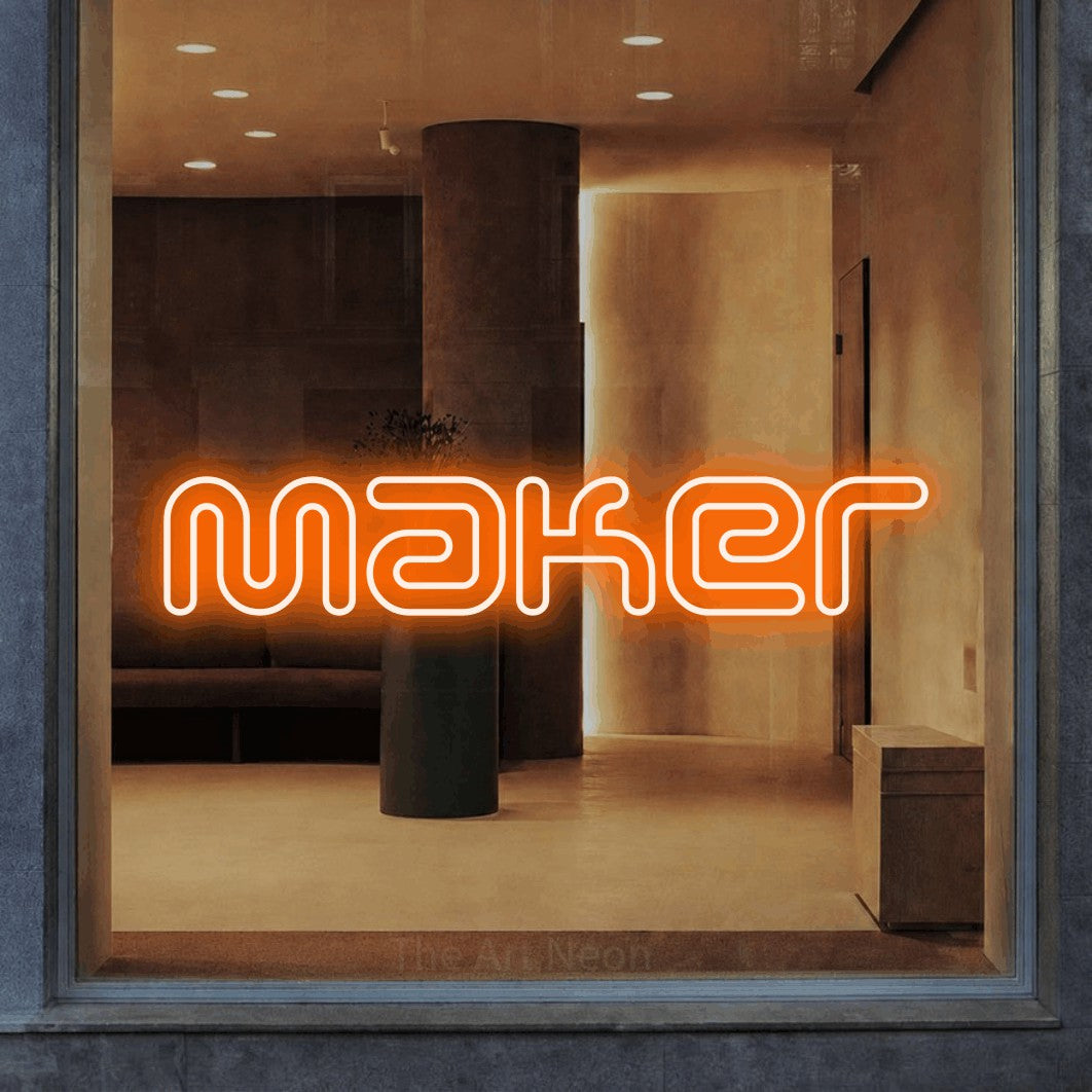 LED neon sign reading “Maker”, arranged in a single line.