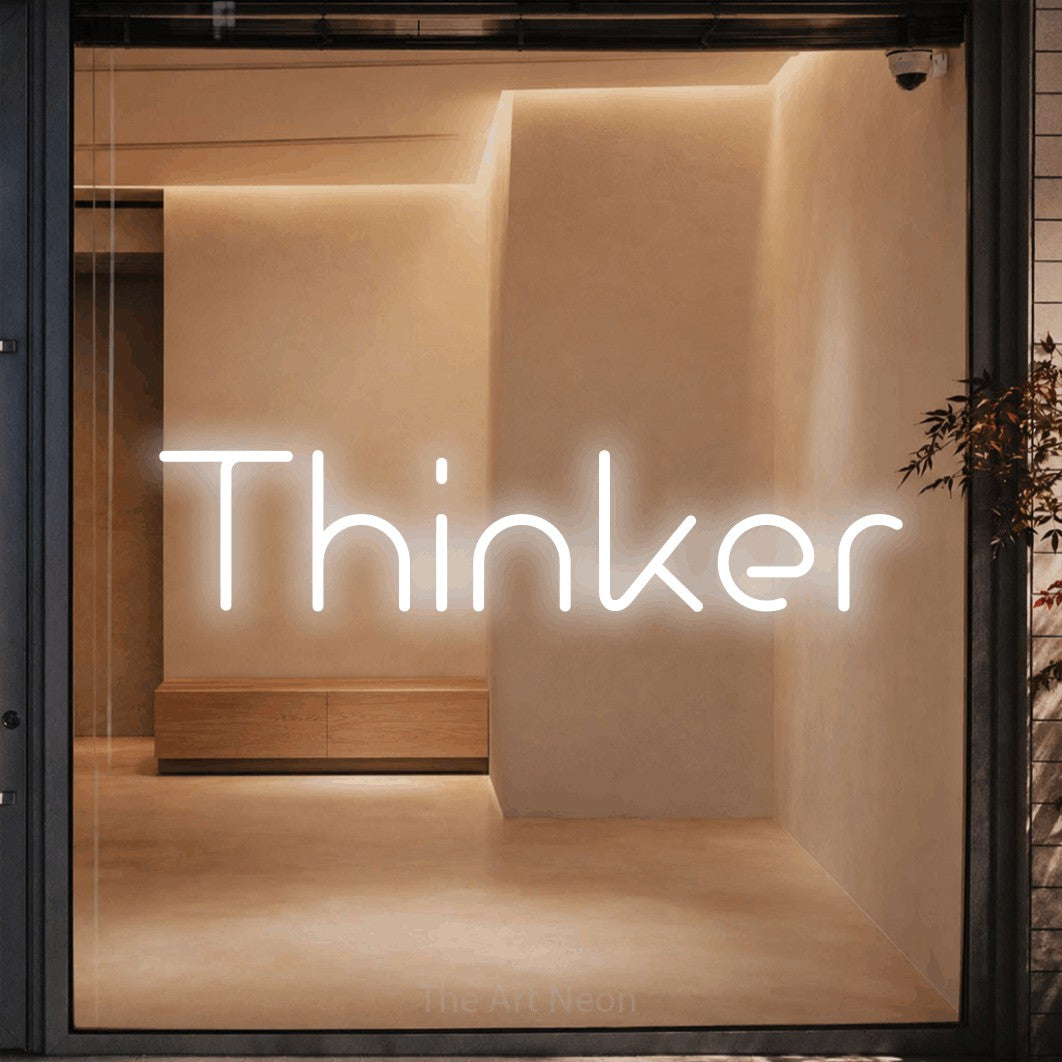 LED neon sign reading “Thinker”, arranged in a single line.