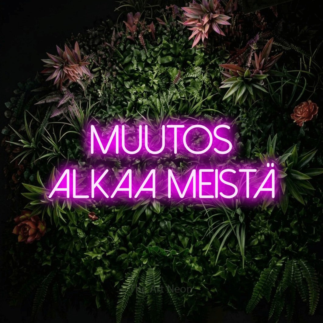 LED neon sign reading “muutos alkaa meistä”, arranged in 2 lines.