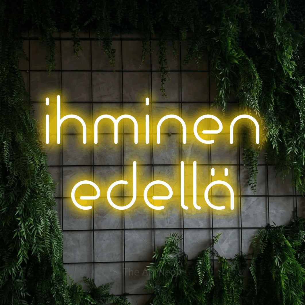 LED neon sign reading “ihminen edellä”, arranged in 2 lines.