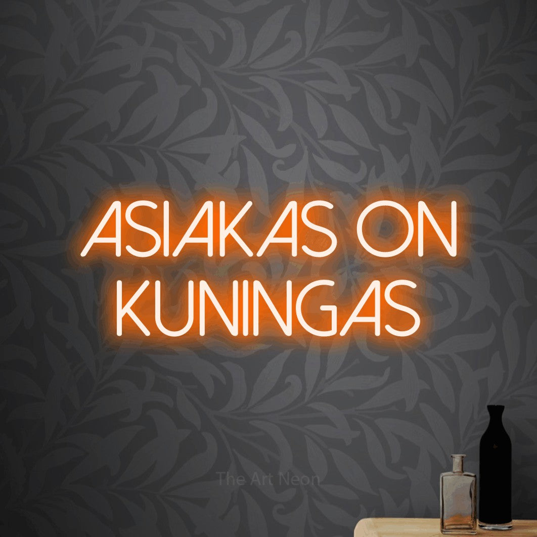 LED neon sign reading “Asiakas on kuningas”, arranged in 2 lines.