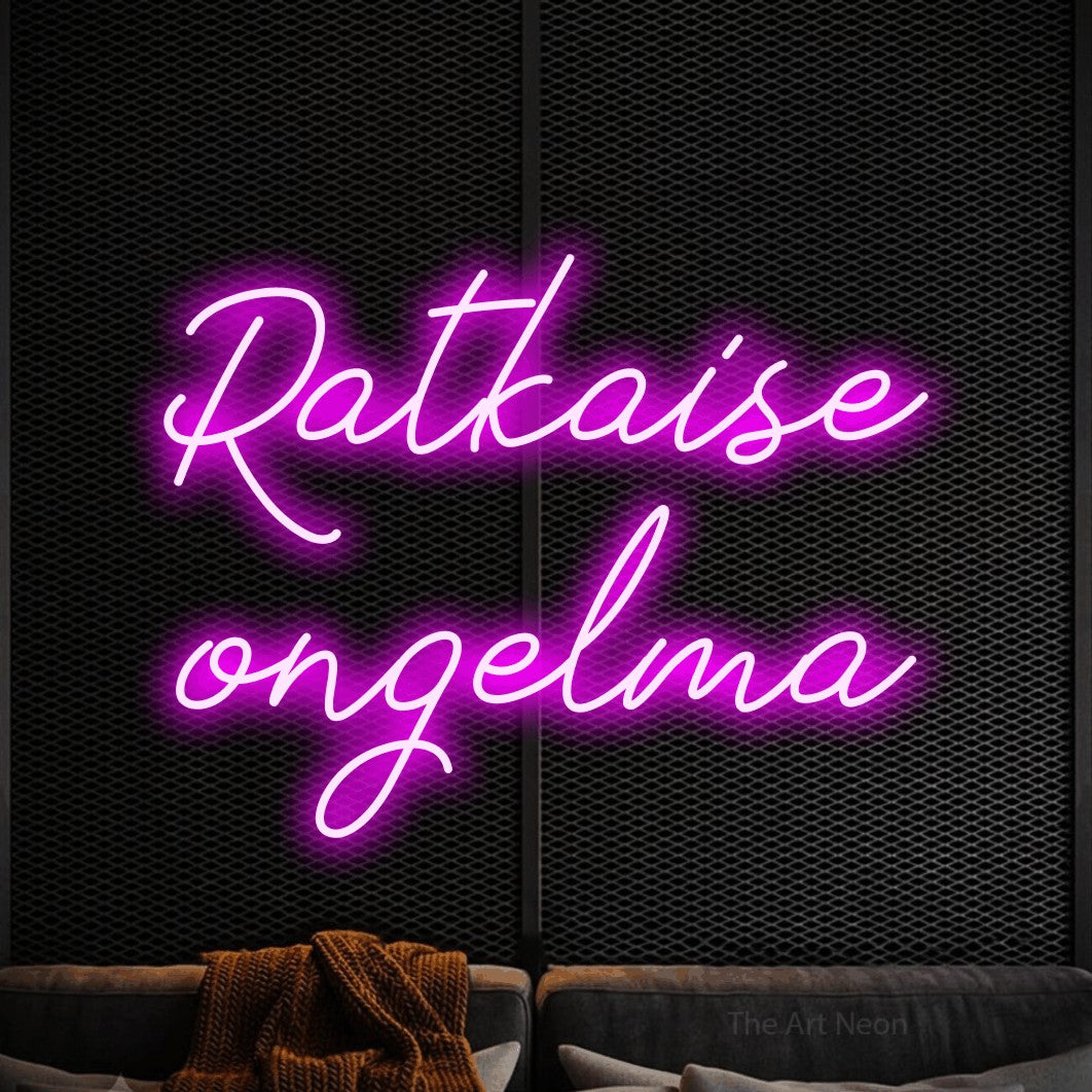 LED neon sign reading “Ratkaise ongelma”, arranged in 2 lines.
