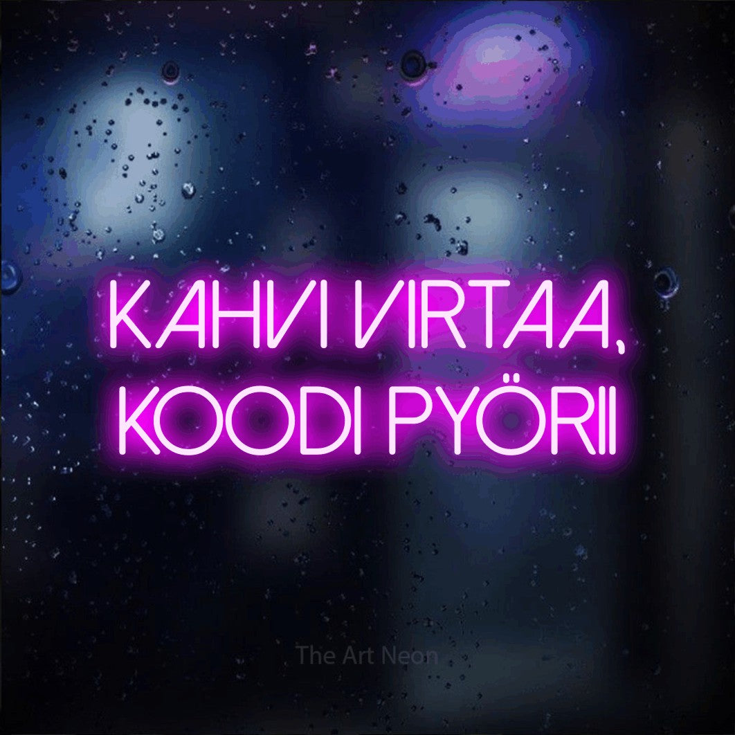 LED neon sign reading “kahvi virtaa, koodi pyörii”, arranged in 2 lines.
