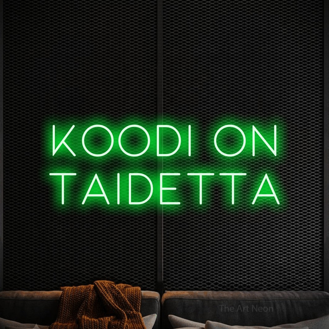 LED neon sign reading “koodi on taidetta”, arranged in 2 lines.