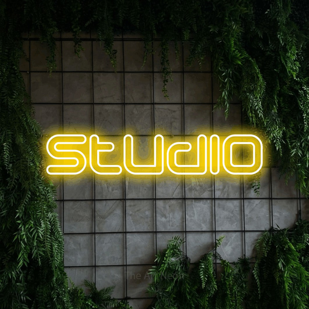 LED neon sign reading “Studio”, arranged in a single line.
