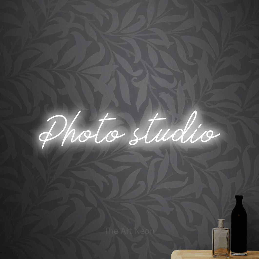 LED neon sign reading “Photo studio”, arranged in a single line.