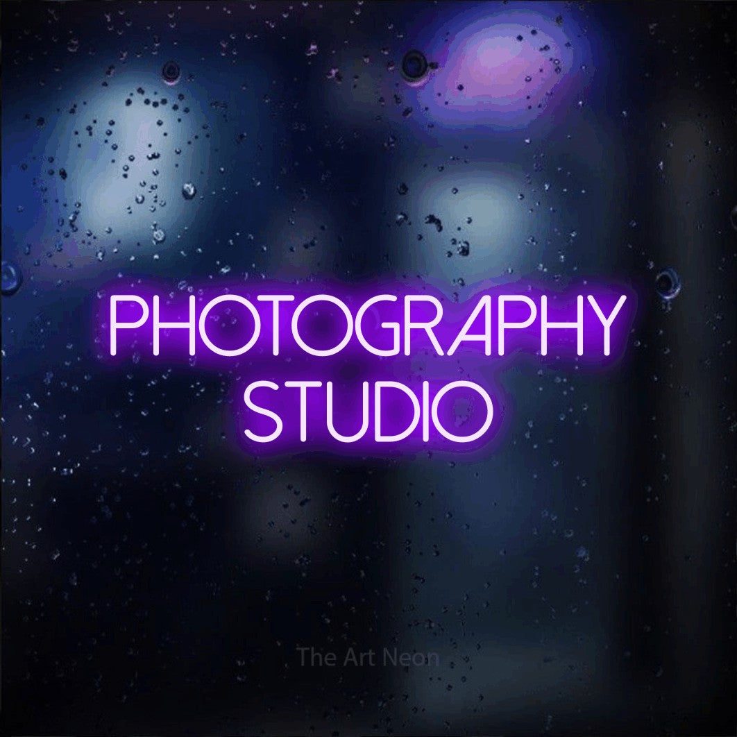 LED neon sign reading “Photography studio”, arranged in 2 lines.