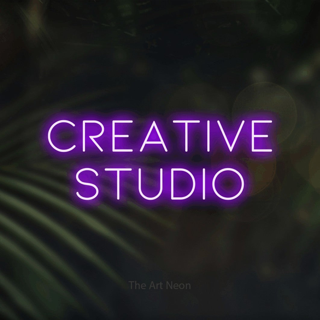 LED neon sign reading “CREATIVE STUDIO”, arranged in 2 lines.