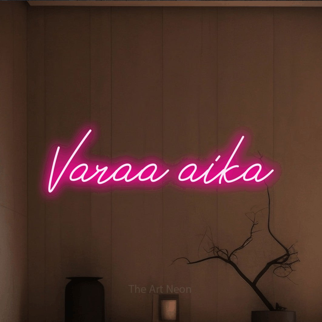 LED neon sign reading “Varaa aika”, arranged in a single line.