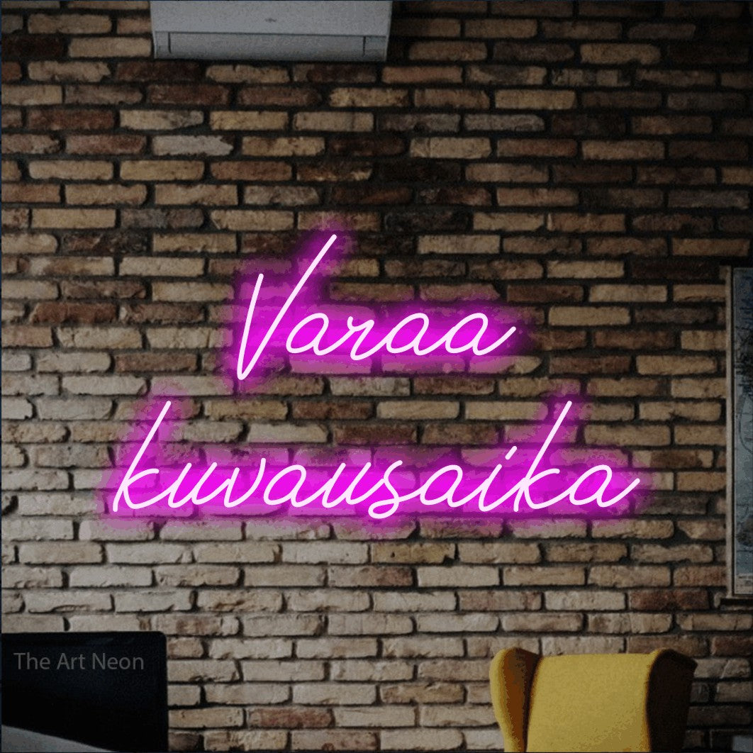 LED neon sign reading “Varaa kuvausaika”, arranged in 2 lines.