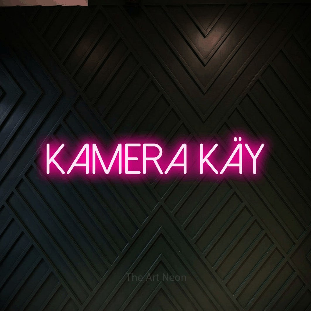 LED neon sign reading “Kamera käy”, arranged in a single line.