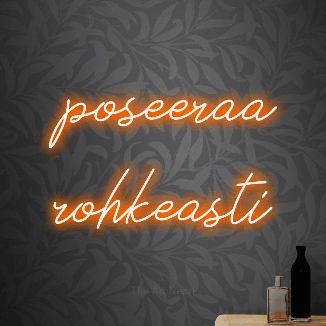 LED neon sign reading “poseeraa rohkeasti”, arranged in 2 lines.