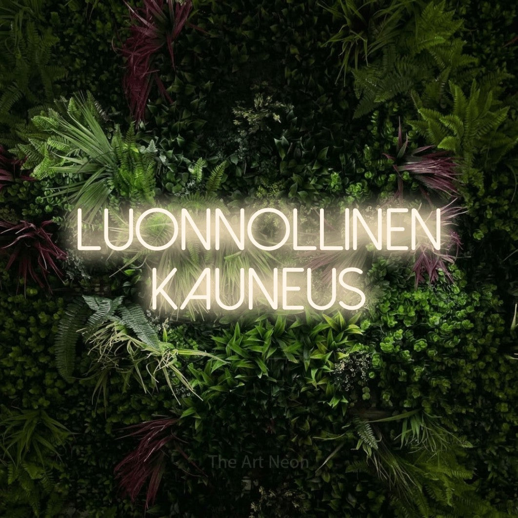 LED neon sign reading “LUONNOLLINEN KAUNEUS”, arranged in 2 lines.