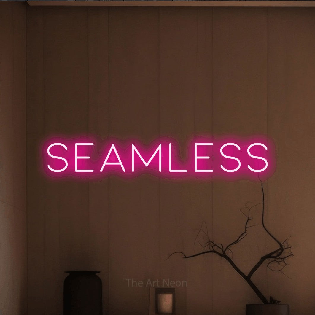 LED neon sign reading “seamless”, arranged in a single line.