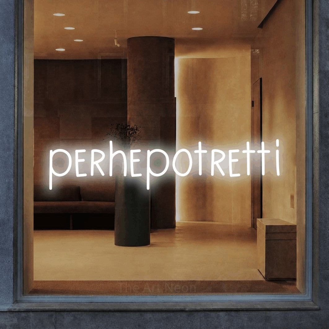LED neon sign reading “perhepotretti”, arranged in a single line.