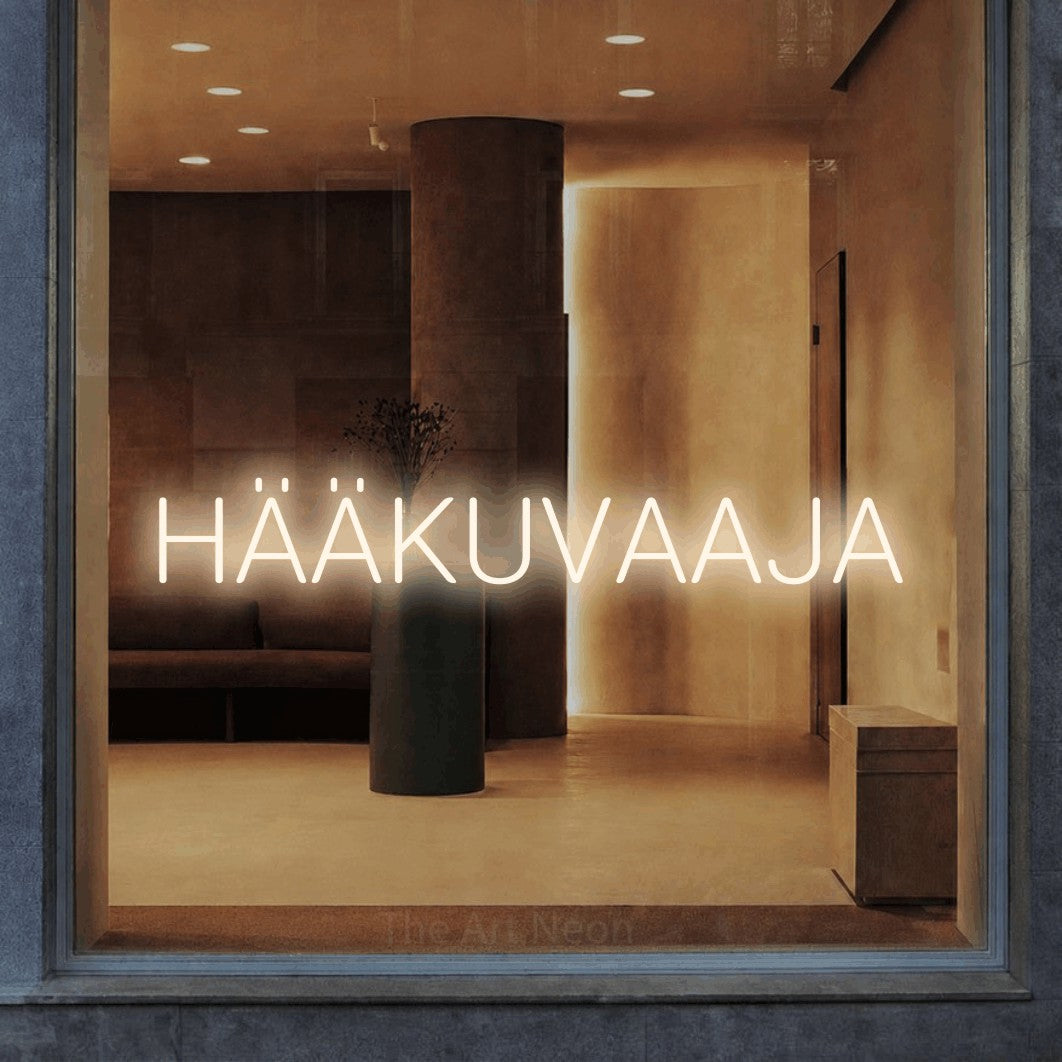 LED neon sign reading “HÄÄKUVAAJA”, arranged in a single line.