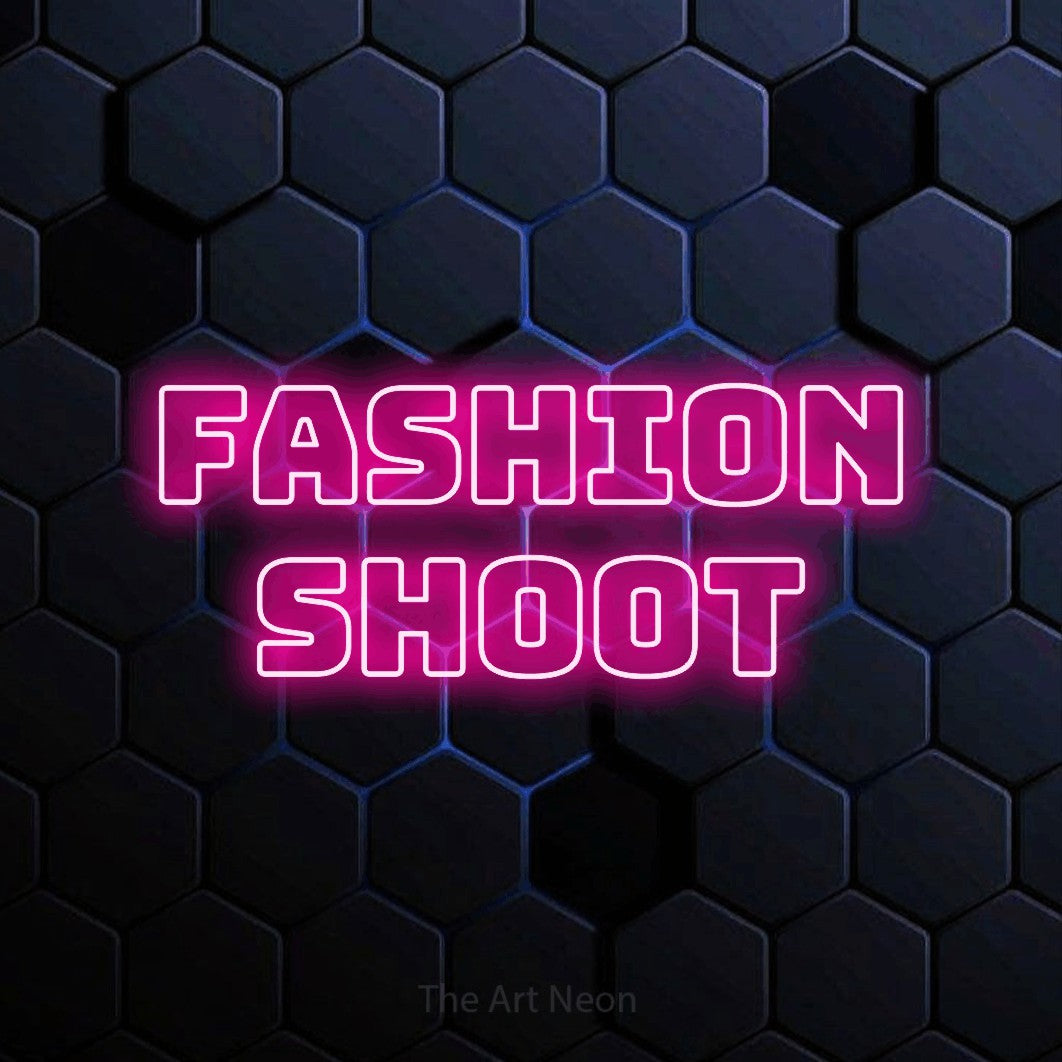 LED neon sign reading “Fashion shoot”, arranged in 2 lines.