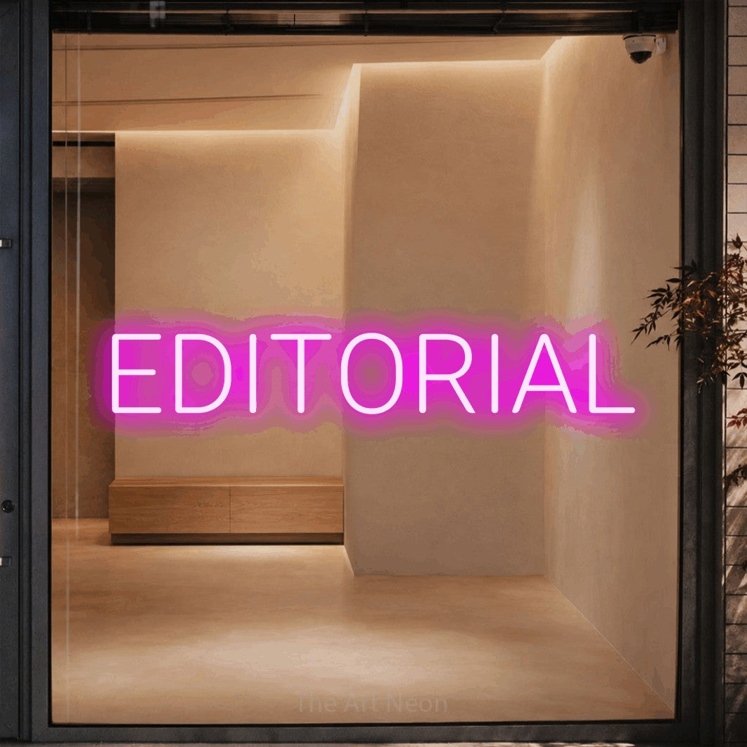 LED neon sign reading “EDITORIAL”, arranged in a single line.