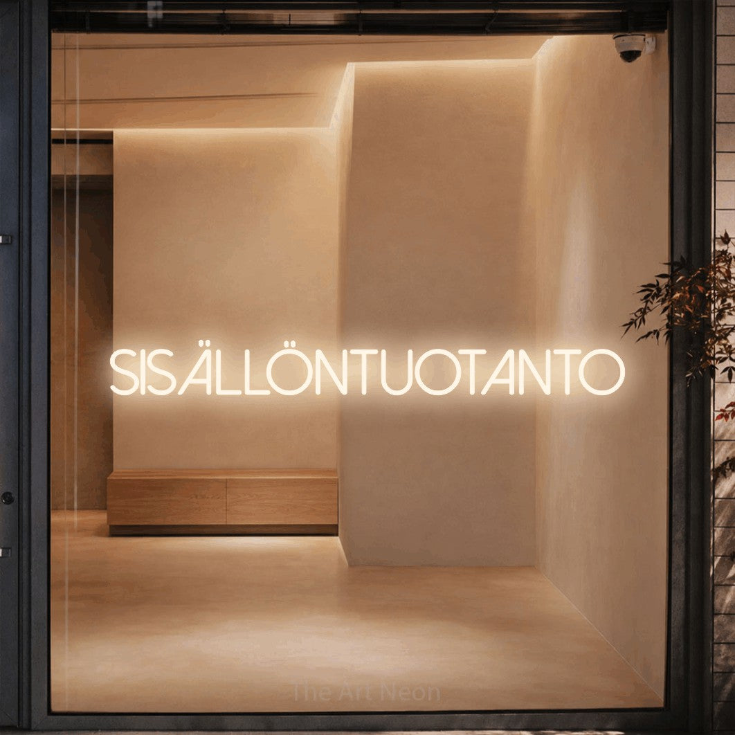 LED neon sign reading “Sisällöntuotanto”, arranged in a single line.