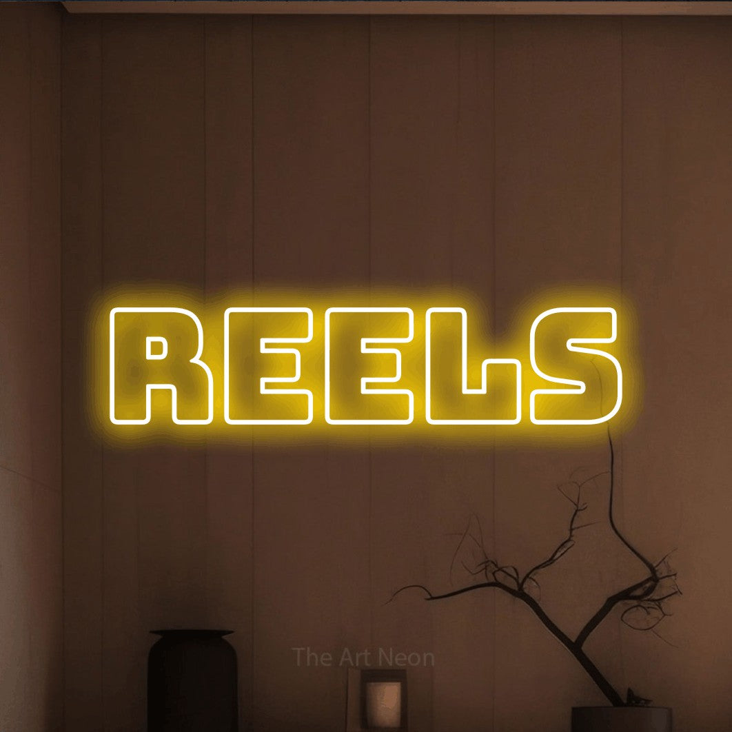 LED neon sign reading “Reels”, arranged in a single line.
