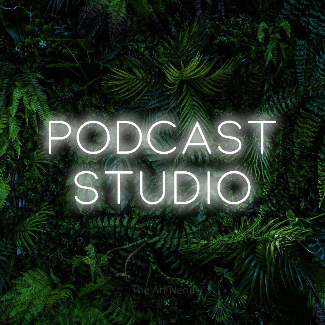 LED neon sign reading “PODCAST STUDIO”, arranged in 2 lines.