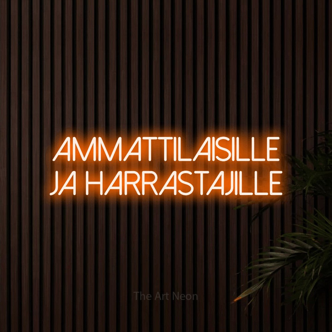 LED neon sign reading “ammattilaisille ja harrastajille”, arranged in 2 lines.