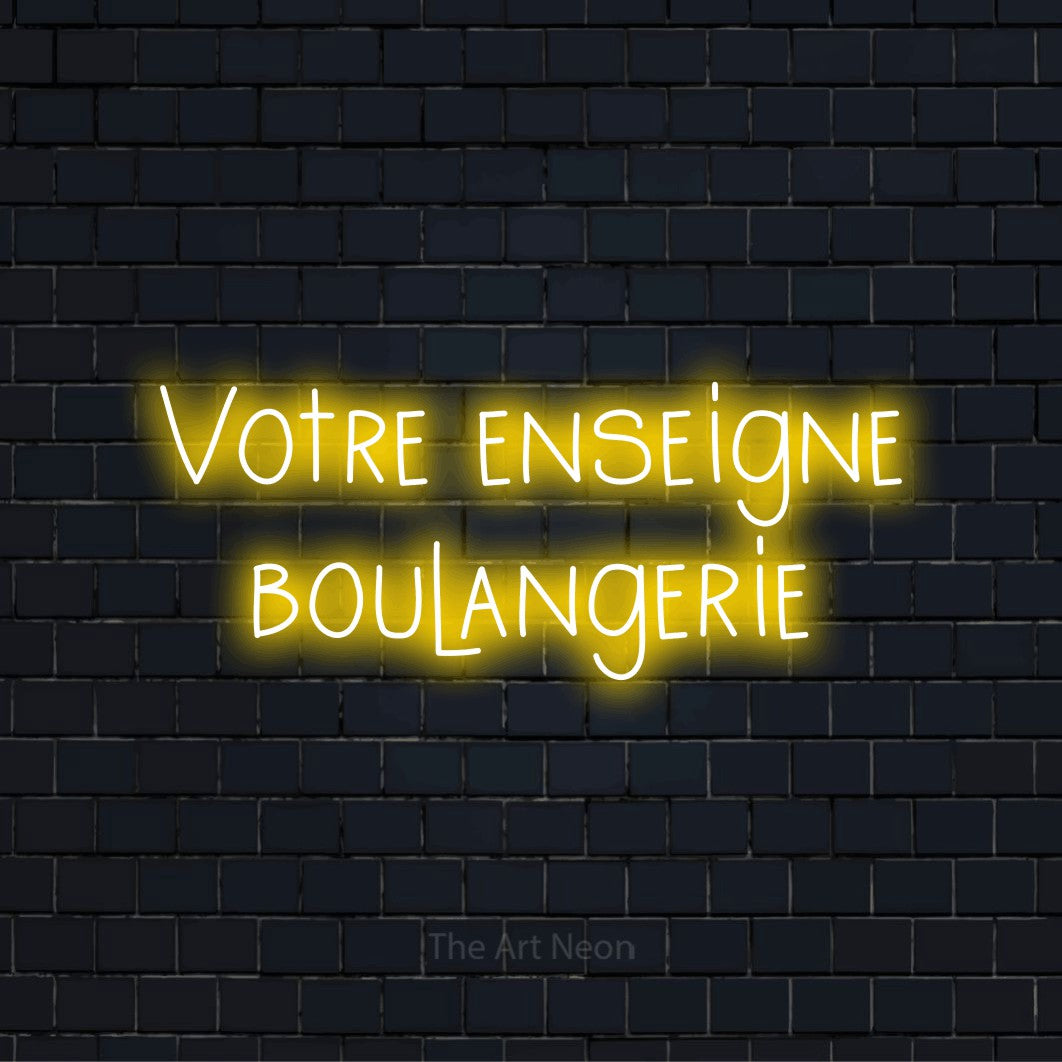 Enseigne néon personnalisée « Votre enseigne boulangerie » sur un mur en briques noires