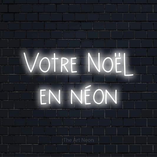 Enseigne néon personnalisée « Votre Noël en néon » sur un mur en briques noires