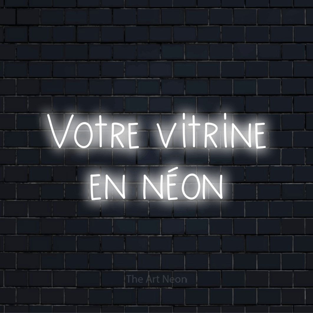 Enseigne néon personnalisée « Votre vitrine en néon » sur un mur en briques noires