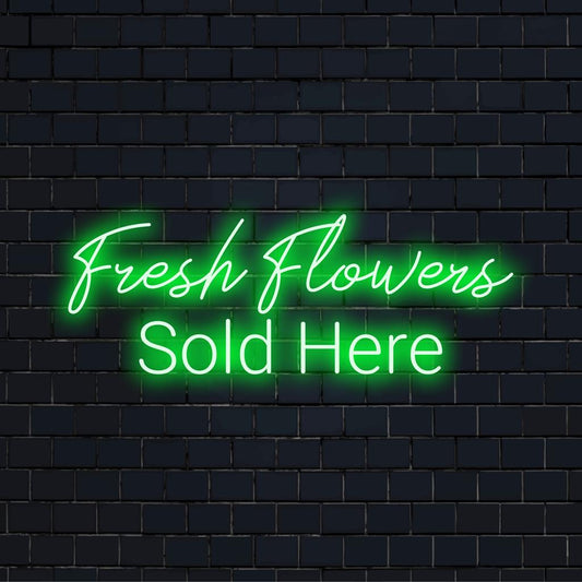 Tässä valoisassa ja kutsuvassa mittatilaustyönä tehdyssä LED-valokyltissä lukee "Tuoreita kukkia myydään täällä".