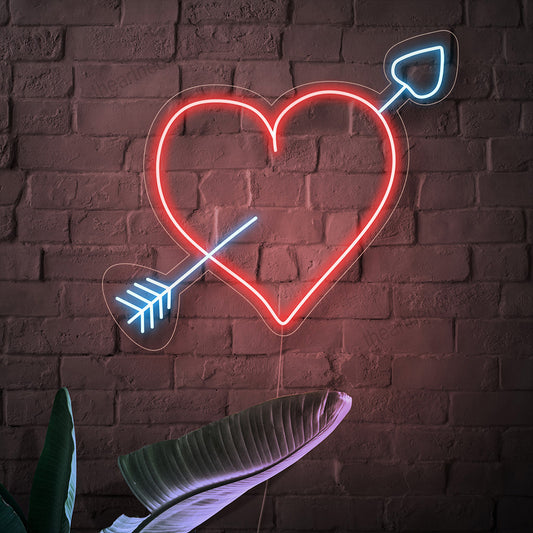 "Heart With Arrow Neon Sign" - Symbolizing love and passion, perfect for spaces that celebrate love stories, weddings, or simply want to convey a sense of timeless romance.