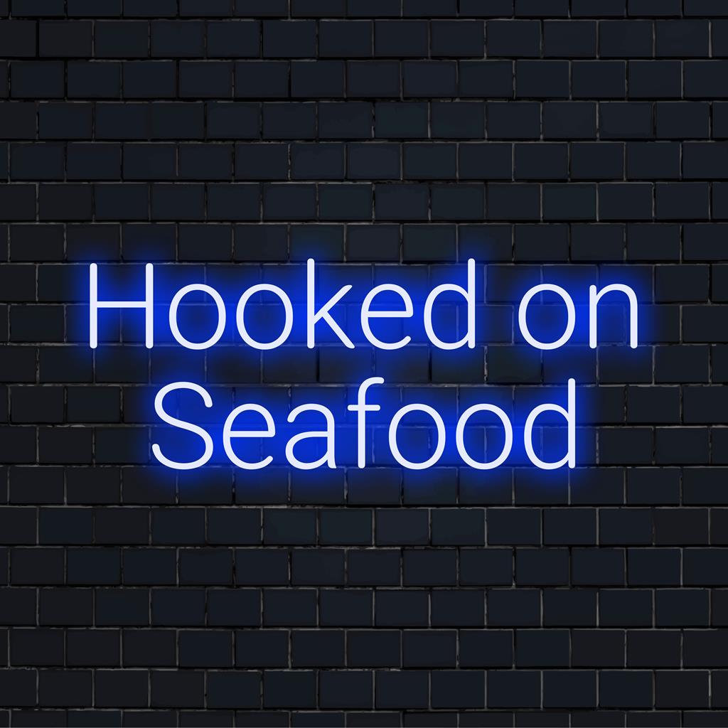 Custom Made LED Neon Sign Hooked On Seafood – vibrant neon light perfect for ocean-themed decor or personalized ambiance.