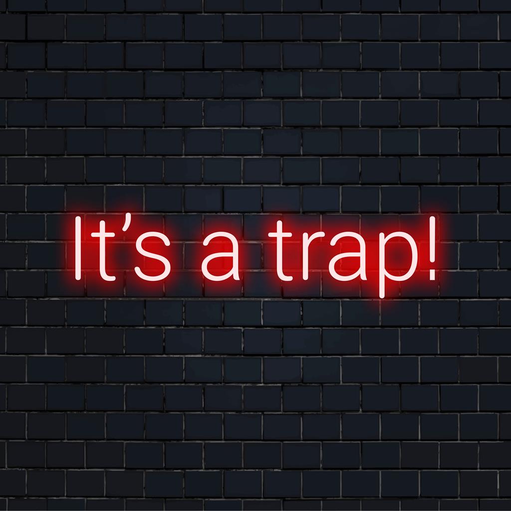 Skräddarsydd LED-neonskylt med frasen It's A Trap! i ljust, slående neonljus, perfekt för unik väggdekoration.