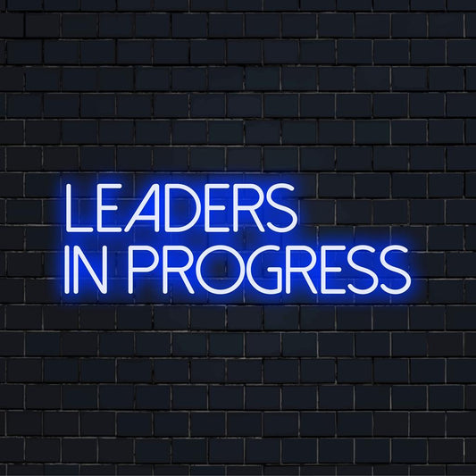 Custom made LED neon sign reading Leaders In Progress, ideal for wall art and personalized light decor.